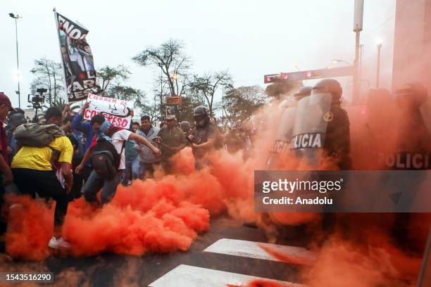 Demonstrators clash with police during the nationwide demonstration against the government in Lima, Peru on July 19, 2023.