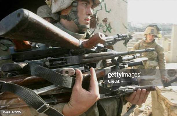 Picture made available 21 November 2004 by the US army shows Marines of the 3rd Battalion 1st Marines, 1st Marine Division and Iraqi special Security...