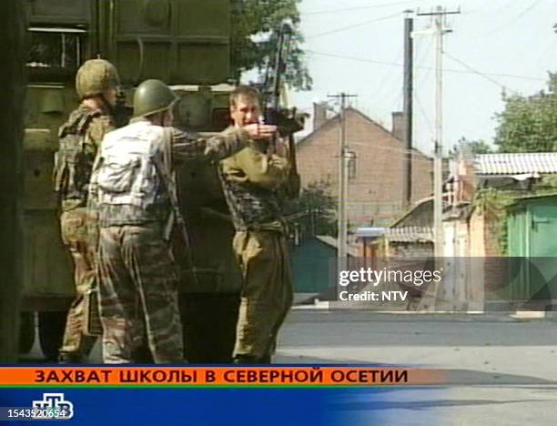 Grab taken from the Russian NTV channel 01 September 2004 shows Russian special police forces soldiers taking position during an operation in the...