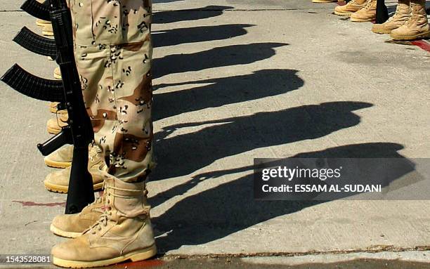 The shadow of a Iraqi Coast Guard cast on the floor during their graduation in the southern city of Basra. More than 360 ICG ended their 9 months...