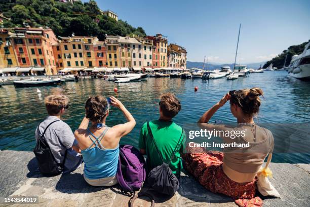 family sightseeing portofino, italy - portofino stock pictures, royalty-free photos & images