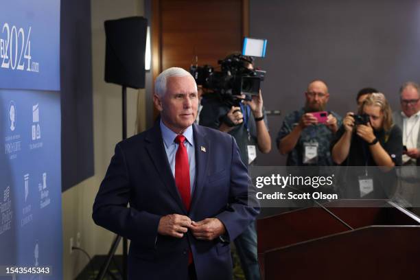 Republican presidential candidate, former Vice President Mike Pence speaks to the press after addressing guests at the Family Leadership Summit on...