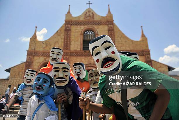 Masked residents perform "Los Abuelos" traditional dance for Queen Sofia of Spain in San Jose de Chiquitos, Santa Cruz department, Bolivia, on...