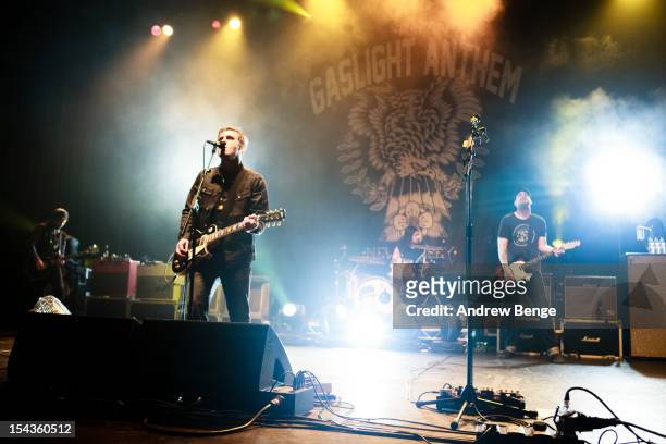 Alex Rosamilia, Brian Fallon, Ian Perkins and Benny Horowitz of The Gaslight Anthem performs on stage at Manchester Apollo on October 18, 2012 in...