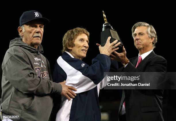 Manager Jim Leyland, team owner Mike Ilitch and General Manager Dave Dombrowski of the Detroit Tigers celebrate with the American League Championship...