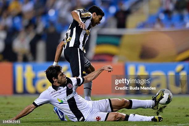 Renato of Botafogo and Juninho Pernambucano of Vasco struggle for the ball during a match between Botafogo and Vasco as part of the Brazilian...