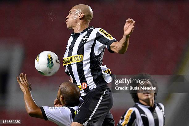 Doria of Botafogo and Felipe Bastos of Vasco struggle for the ball during a match between Botafogo and Vasco as part of the Brazilian Championship...