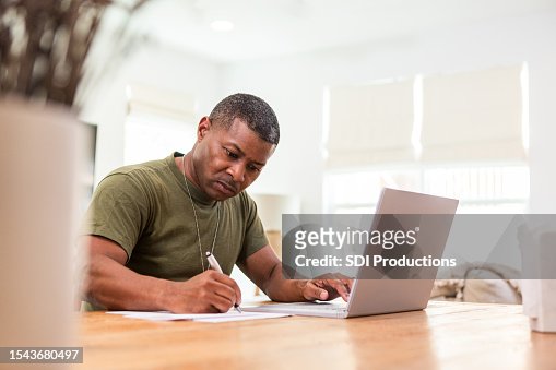 Serious mature soldier continues education online