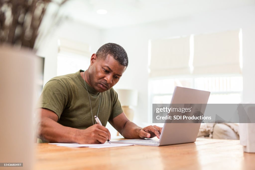 Serious mature soldier continues education online