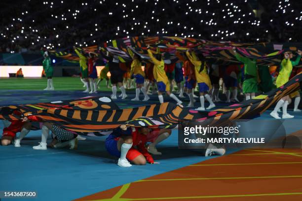 Participants take part in the opening ceremony of the Australia and New Zealand 2023 Women's World Cup ahead of the Group A football match between...