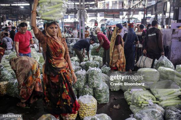 Bags of vegetables at a wholesale vegetable market in Ahmedabad, India, on Wednesday, July 19, 2023. A spike in inflation in June justifies the...