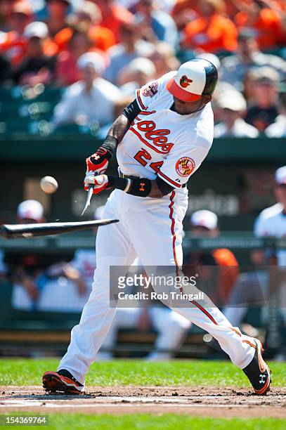 Wilson Betemit of the Baltimore Orioles breaks his bat while batting during the game against the Tampa Bay Rays at Oriole Park at Camden Yards on...