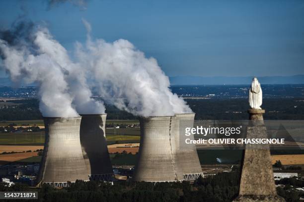 Steam rises from the cooling towers of the Bugey nuclear power plant in Saint-Vulbas, central France, on July 20,2023.