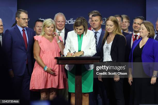 Iowa Governor Kim Reynolds signs into law a bill that will ban most abortions after around six weeks of pregnancy during a visit to the Family...