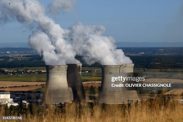 Steam rises from the cooling towers of the Bugey nuclear power plant in Saint-Vulbas, central France, on July 20,2023.