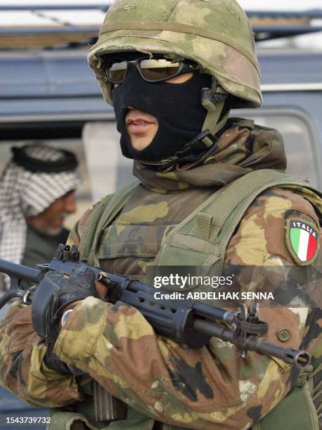 An Italian marines from the San Marco regiment mans a checkpoint near the US military base of Talil, outside the southern Iraqi town of Nasiriyah 05...