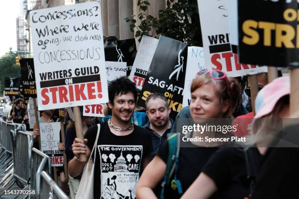 Members of the actors SAG-AFTRA union walk a picket line with screenwriters outside of Netflix's New York office on Day 2 of the actors' strike on...