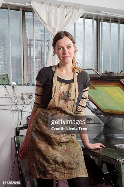 a self employed artist in her studio - white apron stock pictures, royalty-free photos & images