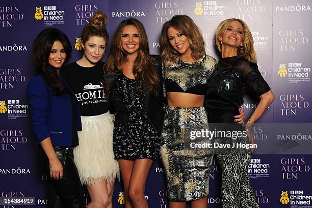 Cheryl Cole, Nicola Roberts, Nadine Coyle, Kimberley Walsh and Sarah Harding of Girls Aloud pose at a press conference to announce 'Girls Aloud Ten,...