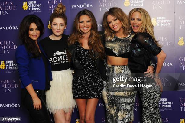 Cheryl Cole, Nicola Roberts, Nadine Coyle, Kimberley Walsh and Sarah Harding of Girls Aloud pose at a press conference to announce 'Girls Aloud Ten,...