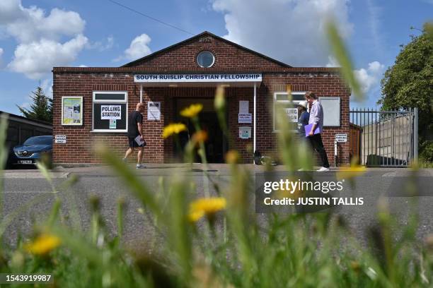 Voters go in and out of the South Ruislip Christian Fellowship being used as a polling station during a by-election in the northwest London...