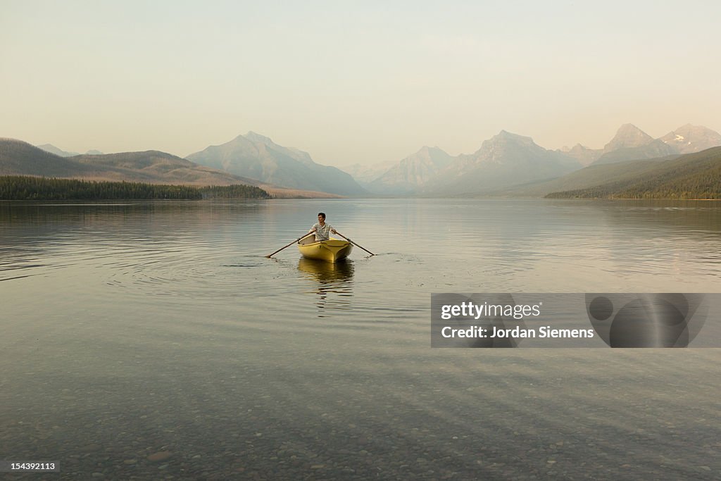 A man in a row boat.