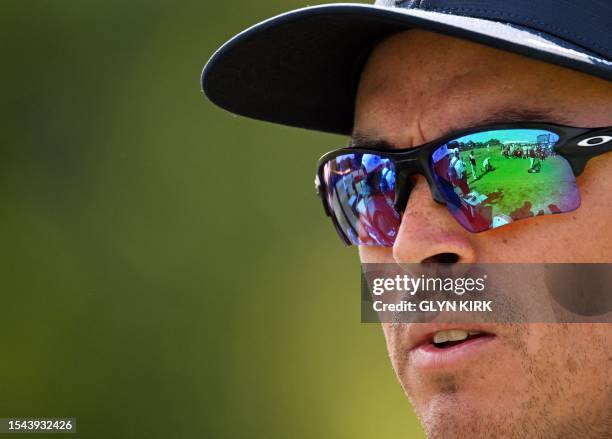 Golfer Rickie Fowler watches from the 5th tee on day one of the 151st British Open Golf Championship at Royal Liverpool Golf Course in Hoylake, north...