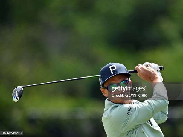 Golfer Rickie Fowler plays from the 5th tee on day one of the 151st British Open Golf Championship at Royal Liverpool Golf Course in Hoylake, north...