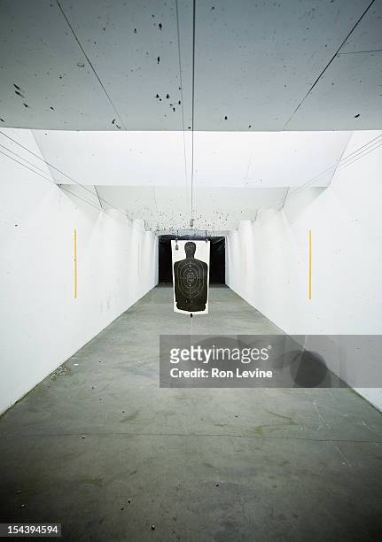 gun range target hanging after use - shooting stock-fotos und bilder