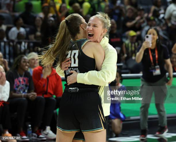 Sabrina Ionescu of the New York Liberty hugs her Liberty teammate Courtney Vandersloot after Ionescu competed in the final round of the WNBA 3-Point...