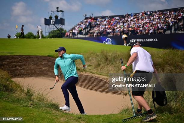 Ireland's Alex Maguire leaves a bunker after playing a shot onto the 17th green on day one of the 151st British Open Golf Championship at Royal...