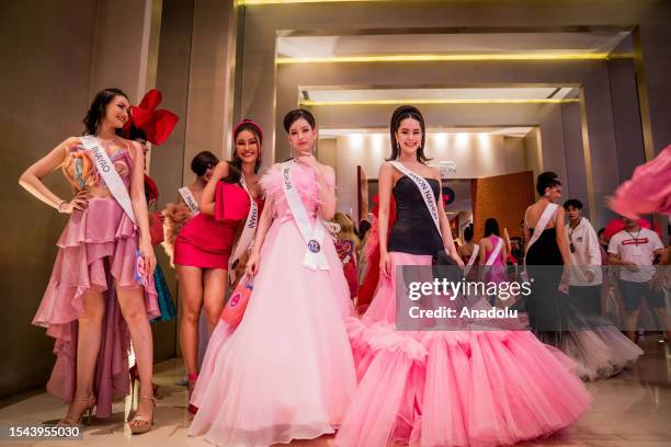 Beauty pageant contestants pose for a photo at the pink carpet during "Barbie" movie premiere in Bangkok, Thailand on July 19, 2023. People attend...