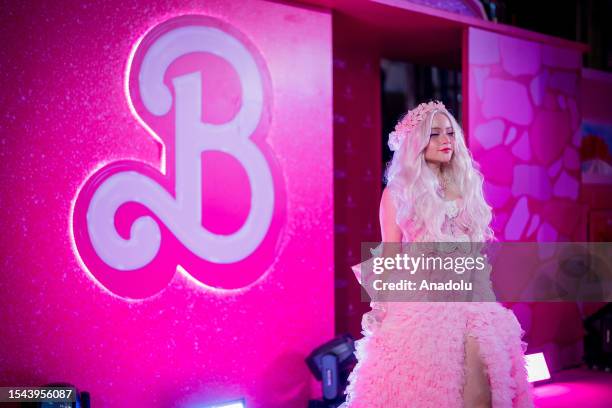 An artist attends the "Barbie" movie premiere in Bangkok, Thailand on July 19, 2023. People attend the pink carpet world premiere of "Barbie" movie...