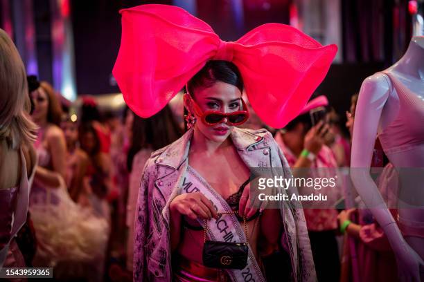 An artist walks to pink carpet during "Barbie" movie premiere in Bangkok, Thailand on July 19, 2023. People attend the pink carpet world premiere of...