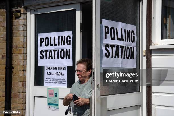 Woman leaves a polling station after casting a vote in the Uxbridge and South Ruislip by-election on July 20, 2023 in Uxbridge, England. The...