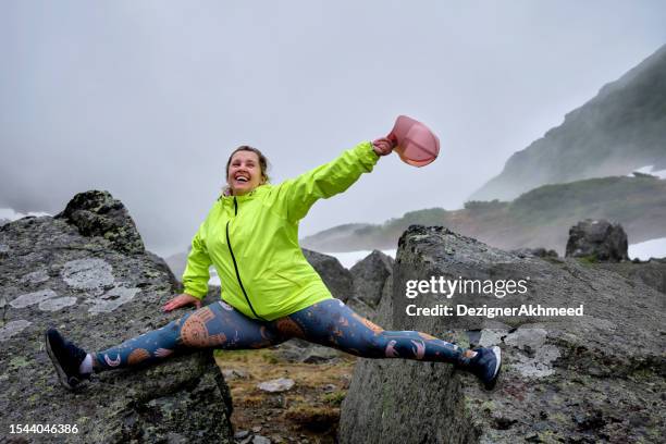 girl on a splits between two stones - rock type stock pictures, royalty-free photos & images
