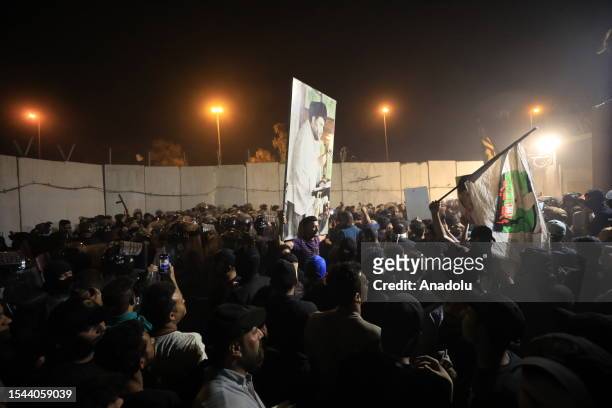 Followers of Shia cleric Muqtada al-Sadr storm the Swedish Embassy as they protest against the act of Quran burning in Baghdad, Iraq on July 20,...