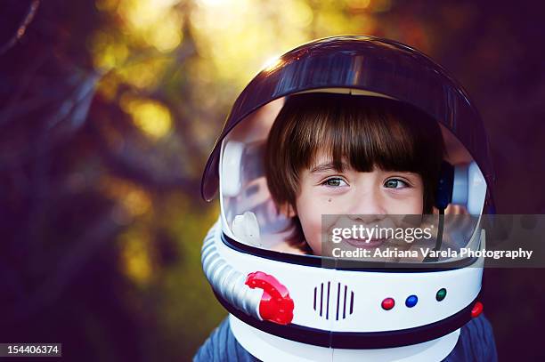 boy in helmet - casco espacial fotografías e imágenes de stock