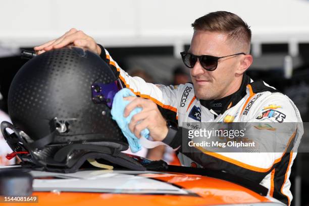 Parker Kligerman, driver of the Spiked Light Coolers Chevrolet, prepares to practice for the NASCAR Xfinity Series Ambetter Health 200 at New...