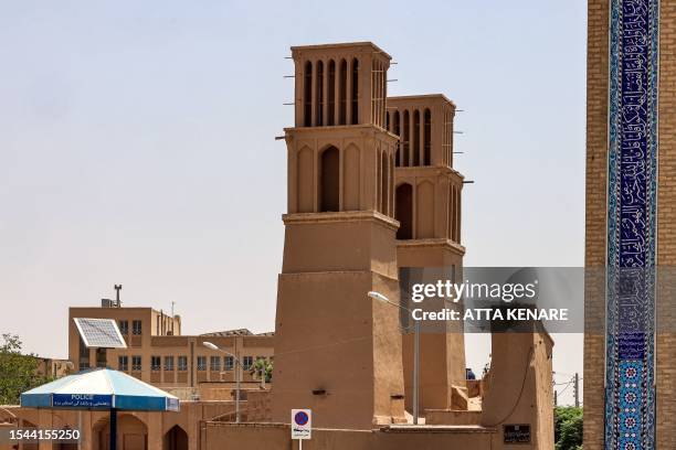 This picture taken on July 3, 2023 shows a view of wind-catchers in Iran's central city of Yazd. Tall, chimney-like towers rise from centuries-old...