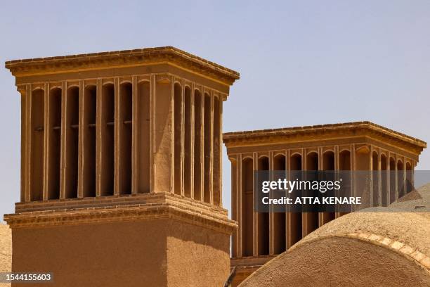 This picture taken on July 3, 2023 shows a view of wind-catchers in Iran's central city of Yazd. Tall, chimney-like towers rise from centuries-old...
