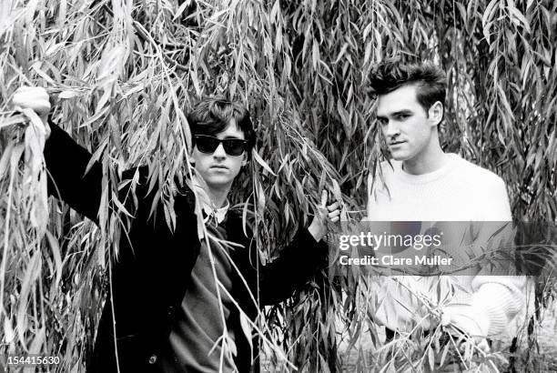 Johnny Marr and Morrissey of the group The Smiths pose under the branches of a willow tree in London in 1983.
