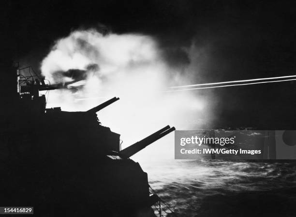 The Royal Navy During The Second World War, The 6-inch guns of HMS MAURITIUS firing during a night action in Audierne Bay between Brest and Lorient,...