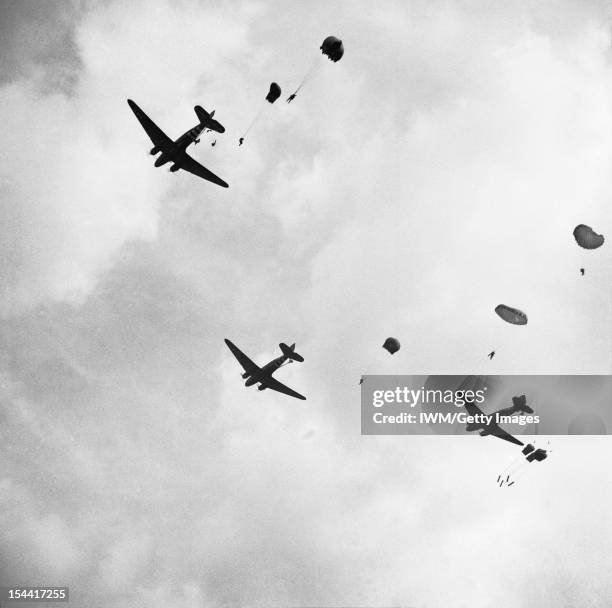 The British Airborne Division At Arnhem And Oosterbeek In Holland, Paratroops drop from Dakota aircraft over the outskirts of Arnhem, 17 September...