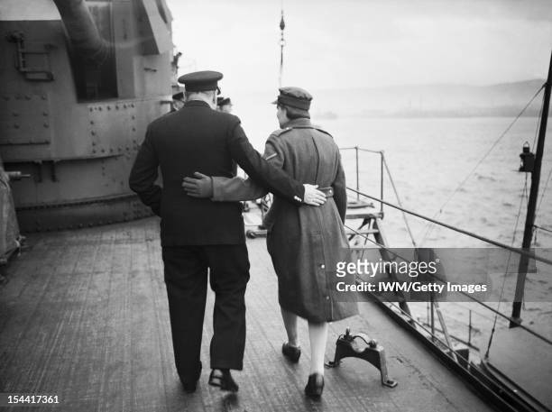 Prime Minister Winston Churchill Aboard HMS Duke Of York For Visit To America, December 1941, Mr Churchill and his daughter Mary walking arm in arm...