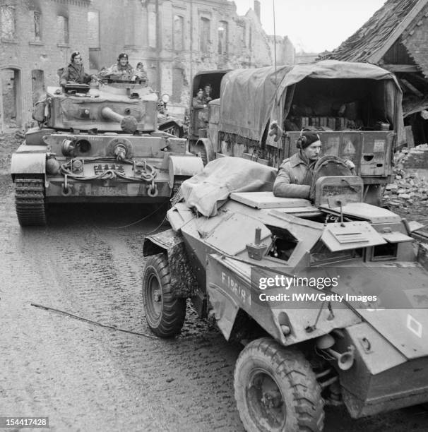 The British Army In North-West Europe 1944-45, A Humber scout car and Comet tank of 11th Armoured Division in a devastated German town, 30 March 1945.