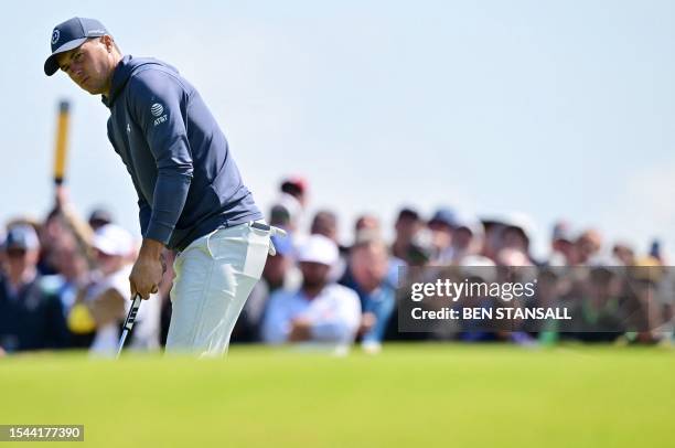 Golfer Jordan Spieth misses a birdie putt on the 17th green on day one of the 151st British Open Golf Championship at Royal Liverpool Golf Course in...