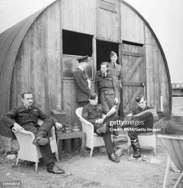 Royal Air Force 1939-1945: Fighter Command, Australian pilots of No. 452 Squadron relax outside their dispersal hut at Kirton-in-Lindsey, 18 June...