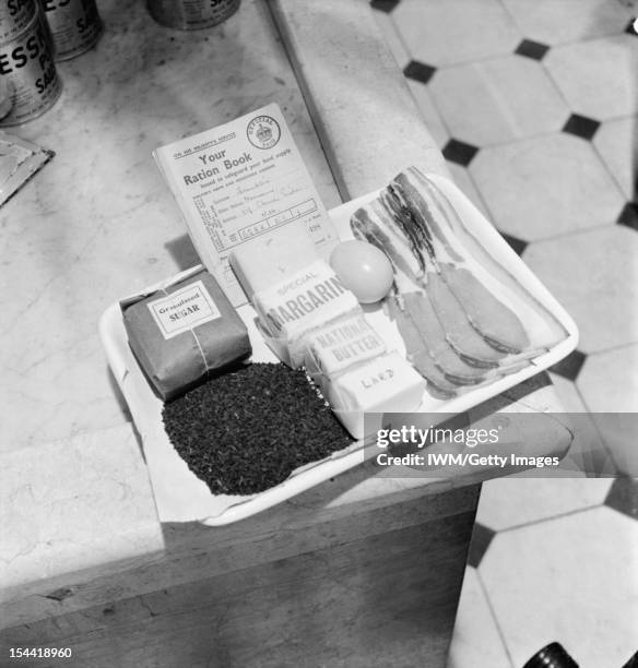 Rationing In Britain During The Second World War A view of a tray containing the ration book for a Mr Norman Franklin and his weekly rations of...