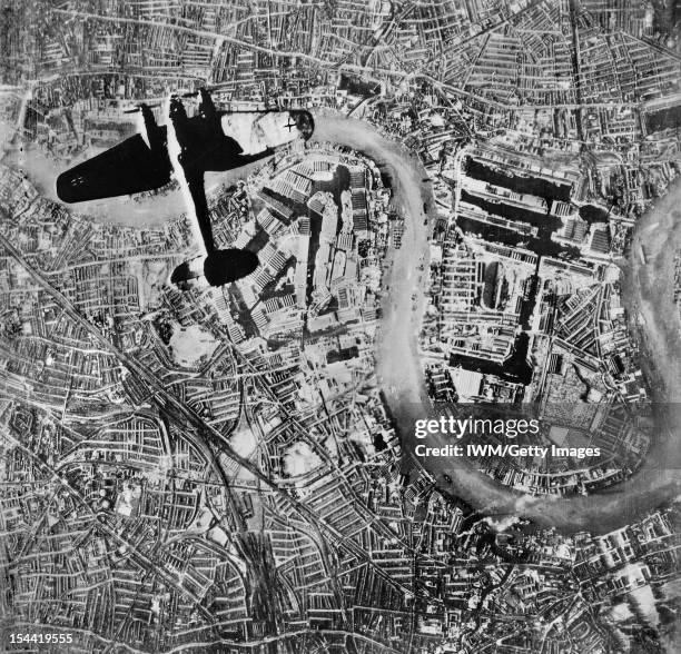 The Battle Of Britain, A Heinkel He 111 bomber flying over the Isle of Dogs in the East End of London, at the start of the Luftwaffe's evening raids...